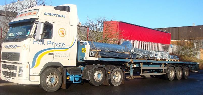 Flat bed trailer with fencing